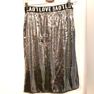 EUC LOVE Bright silver Sequin stretch skirt with elastic black and white waist.